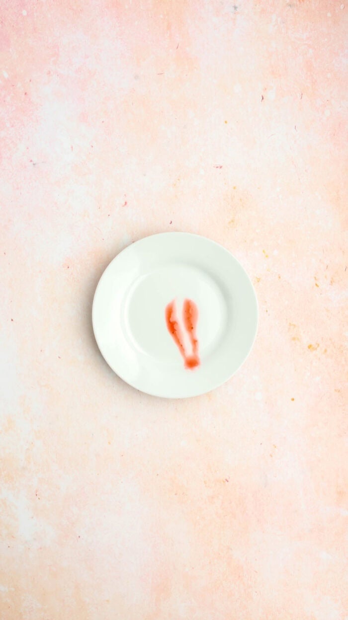 A drop of jam after a finger ran through it to test the jam