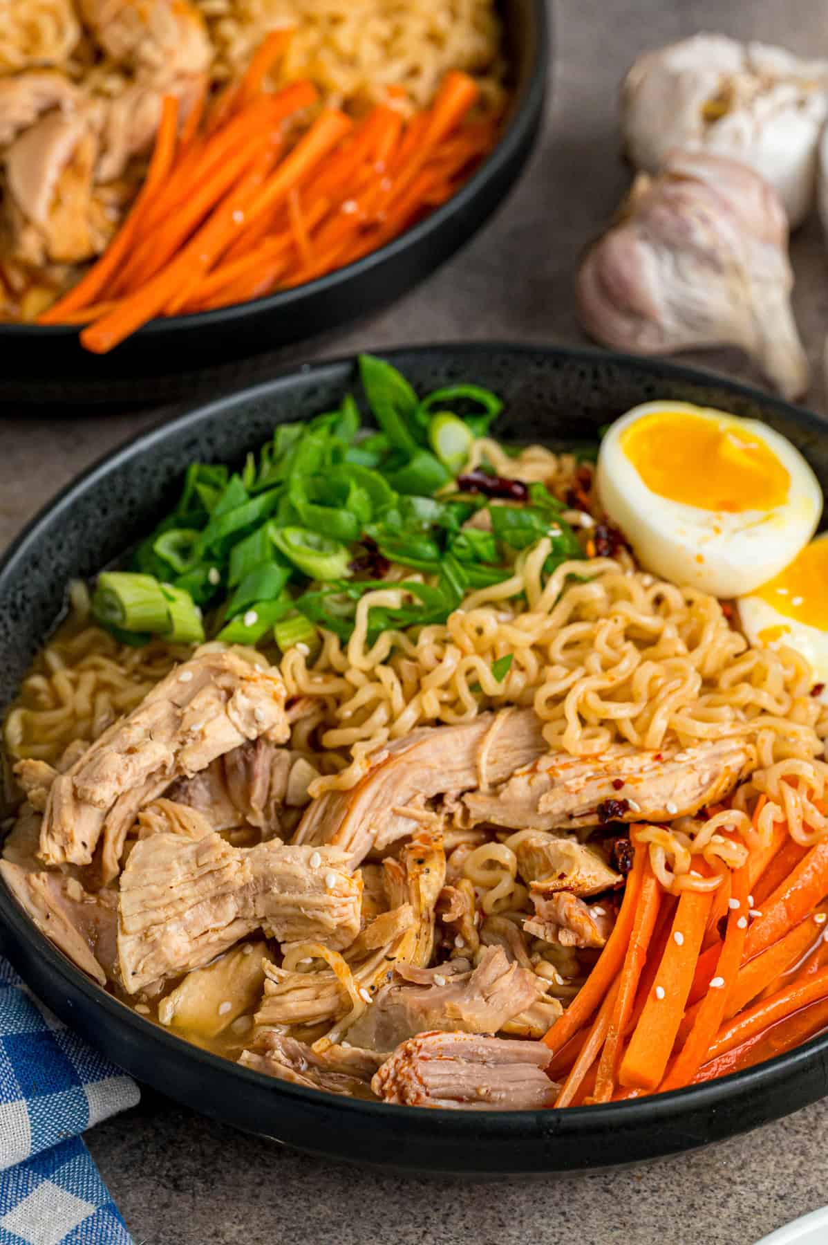 This easy Chicken Ramen recipe turns instant ramen noodles into a flavorful and filling weeknight dinner. Ready in 35 minutes! Close up of a boil of chicken ramen
