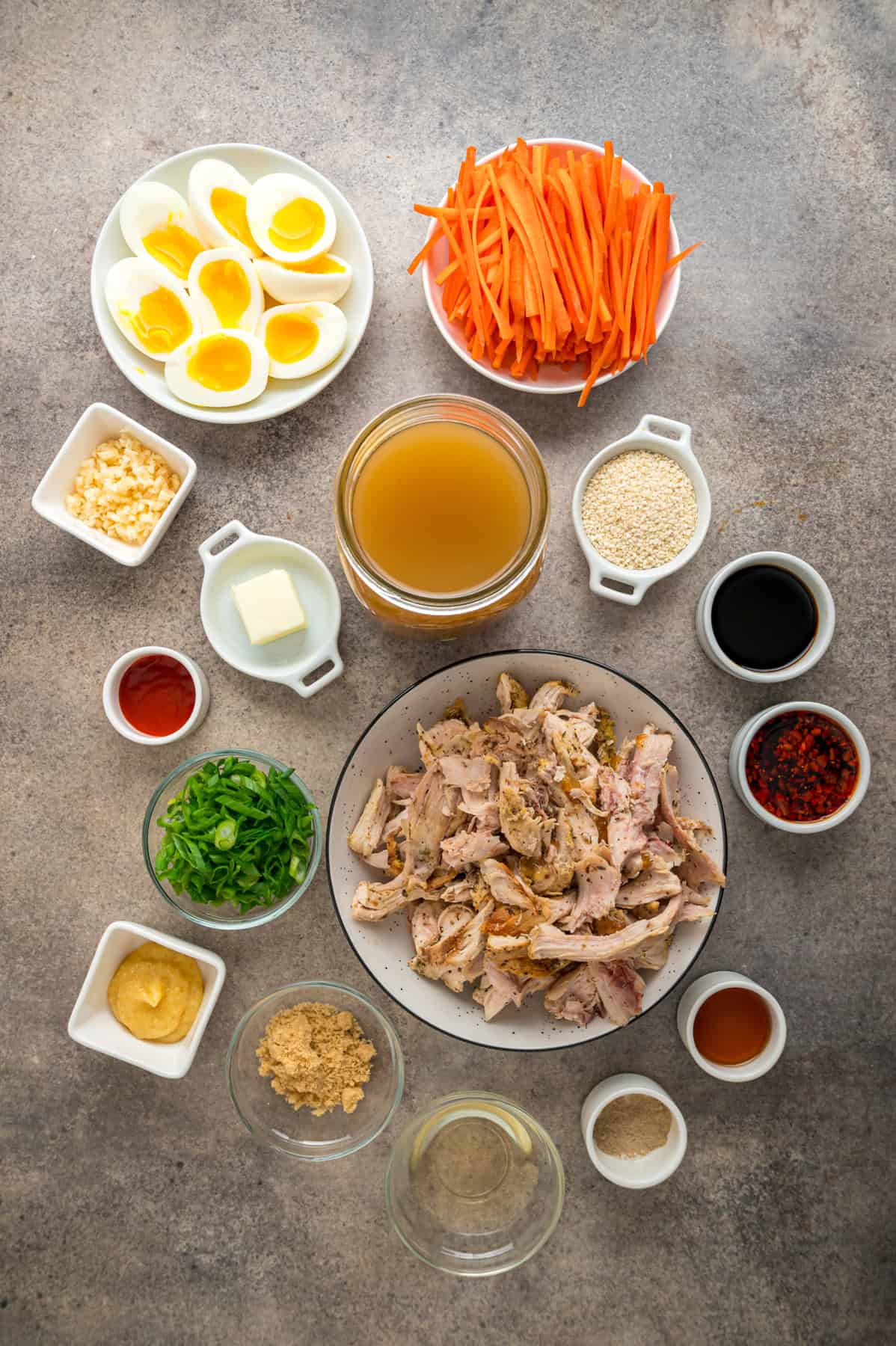 This easy Chicken Ramen recipe turns instant ramen noodles into a flavorful and filling weeknight dinner. Ready in 35 minutes! Overhead view of ingredients needed to make chicken ramen