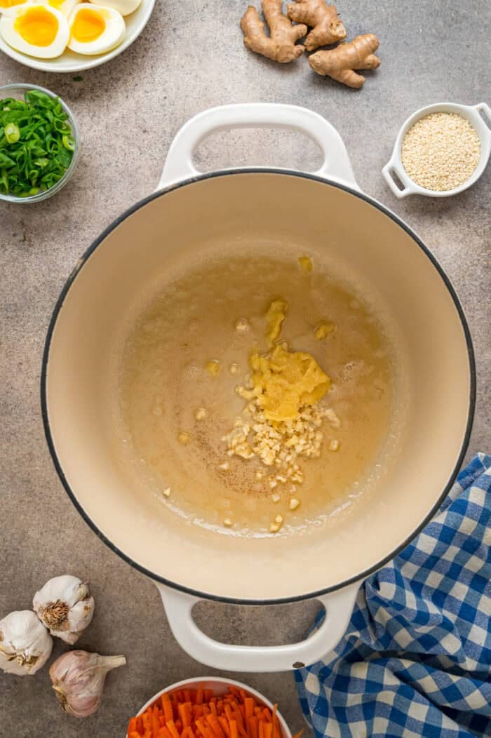 This easy Chicken Ramen recipe turns instant ramen noodles into a flavorful and filling weeknight dinner. Ready in 35 minutes! Garlic and ginger in a pot