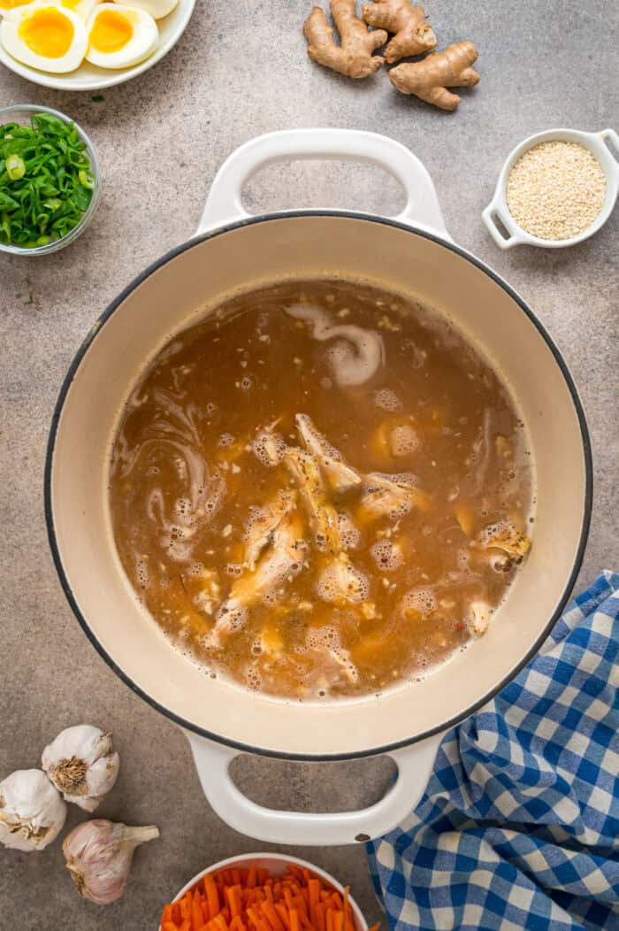 This easy Chicken Ramen recipe turns instant ramen noodles into a flavorful and filling weeknight dinner. Ready in 35 minutes! Ramen broth and chicken in a pot