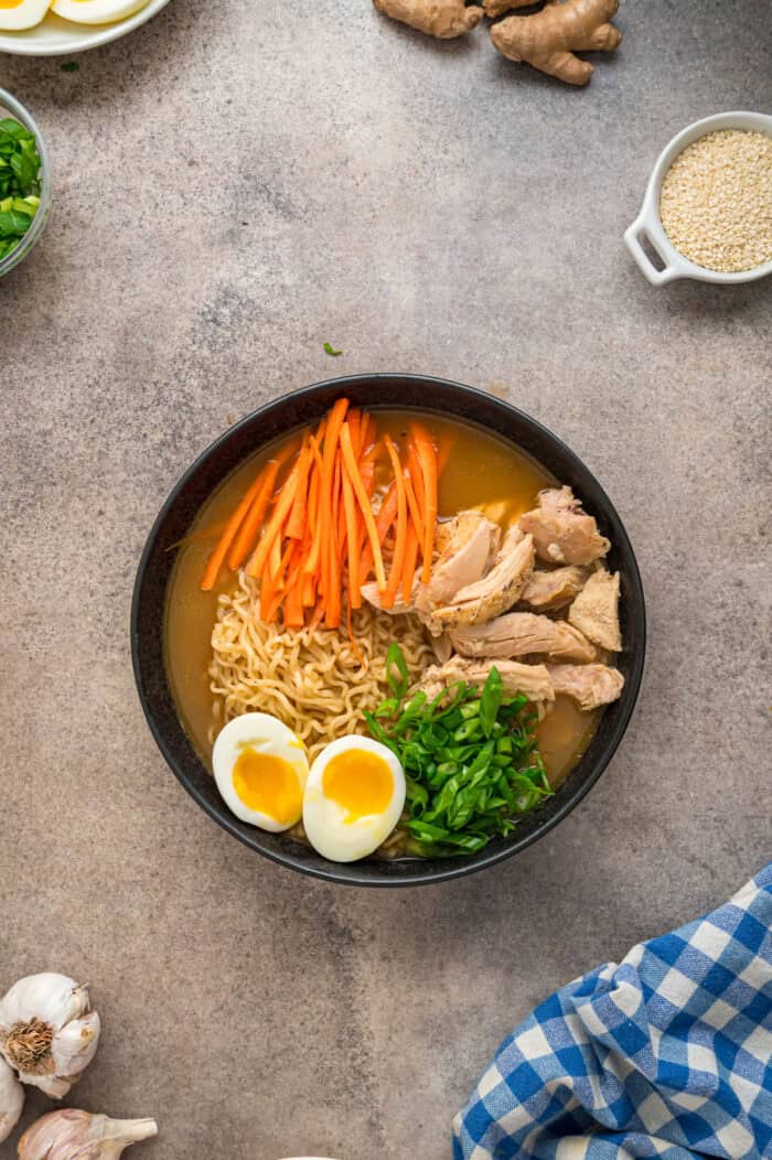 This easy Chicken Ramen recipe turns instant ramen noodles into a flavorful and filling weeknight dinner. Ready in 35 minutes! Overhead view of a bowl of chicken ramen