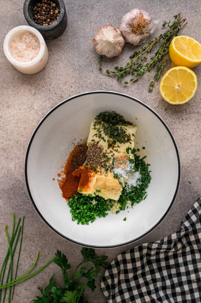 Herbs, butter, and spices in a bowl