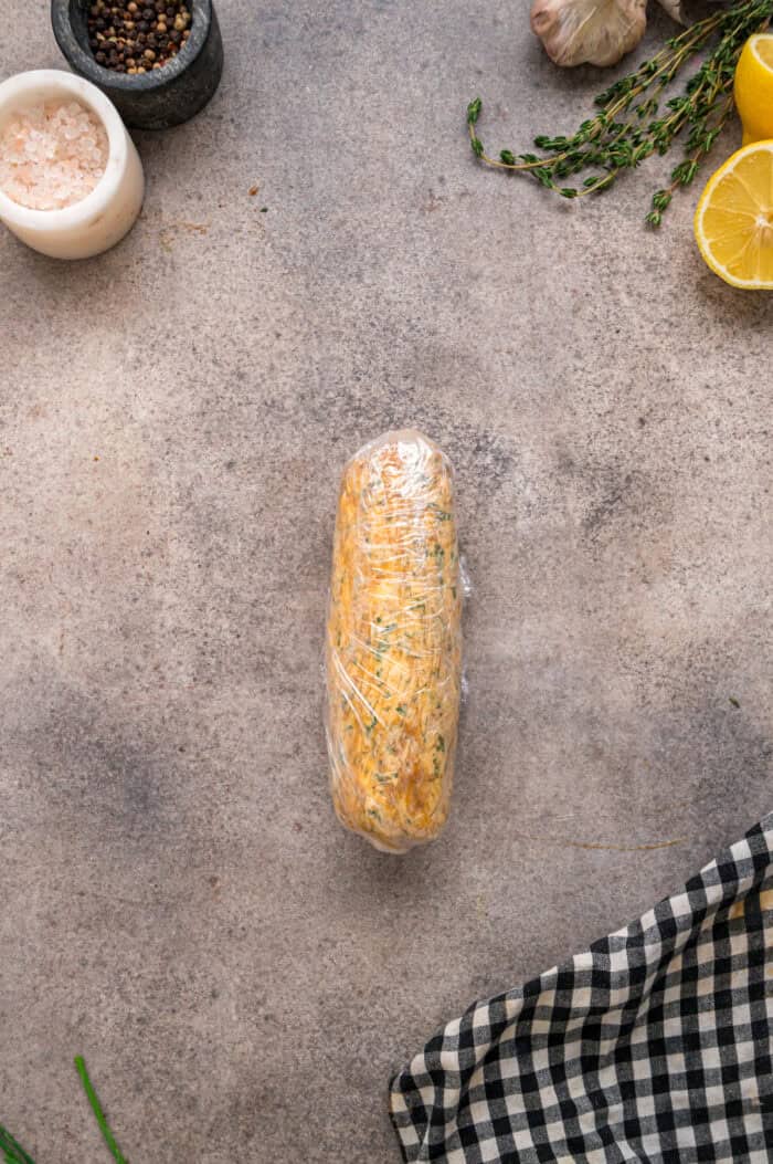 A log of cowboy butter in plastic wrap