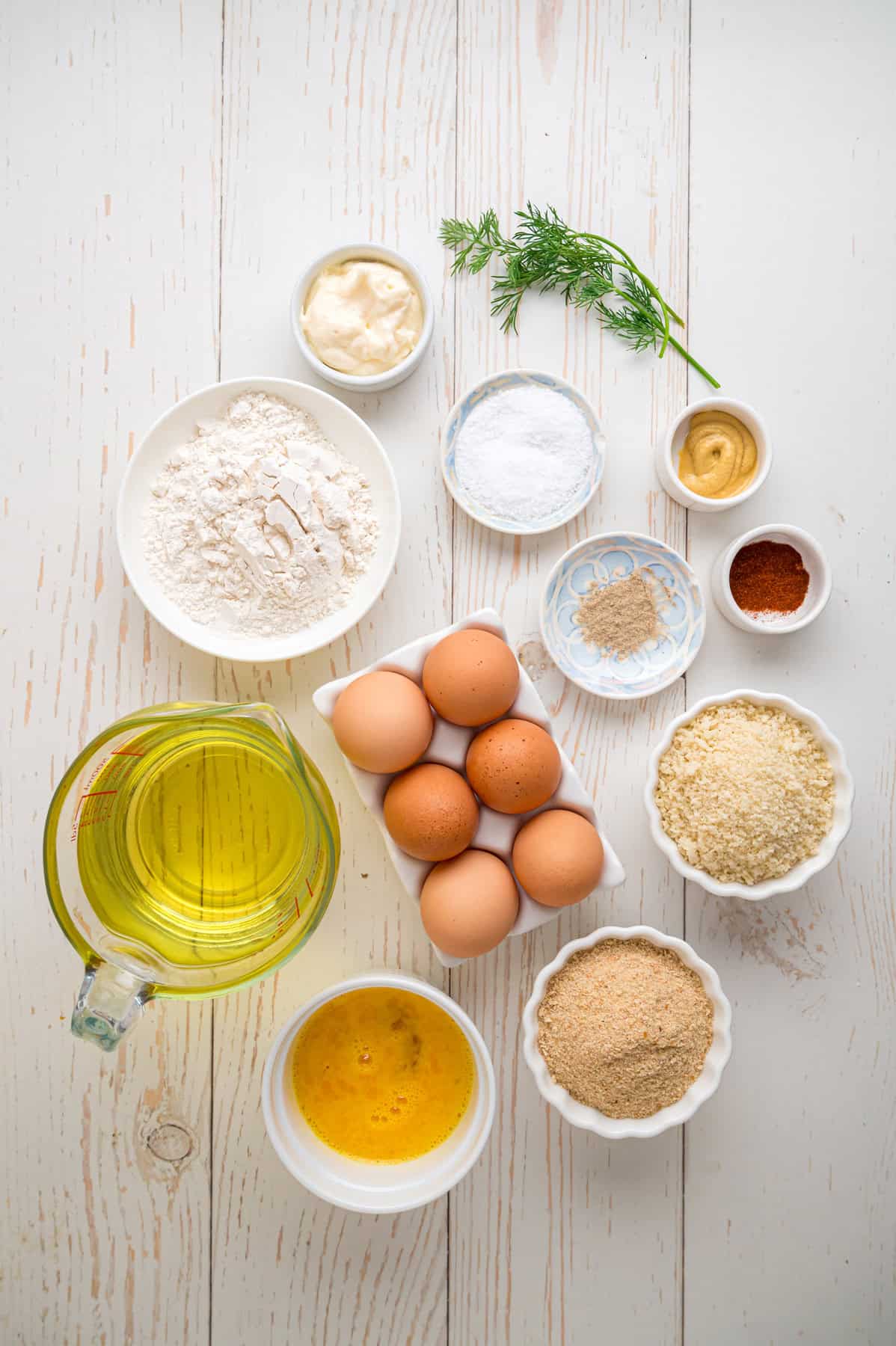 Fried Deviled Eggs are a fun twist on the classic, with hard-boiled egg whites coated in breadcrumbs and deep-fried. Overhead view of ingredients needed to make fried deviled eggs