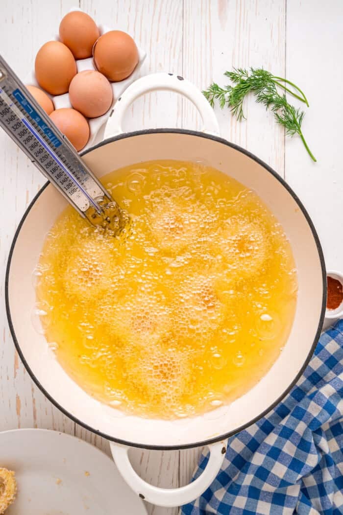 Fried Deviled Eggs are a fun twist on the classic, with hard-boiled egg whites coated in breadcrumbs and deep-fried. Breaded egg whites frying in oil
