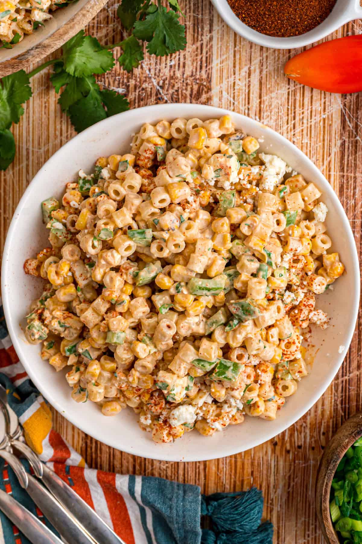 Charred corn kernels, cotija cheese, and pasta are tossed in a creamy dressing to make this Street Corn Pasta Salad. Mexican Street Corn Pasta in a bowl top view