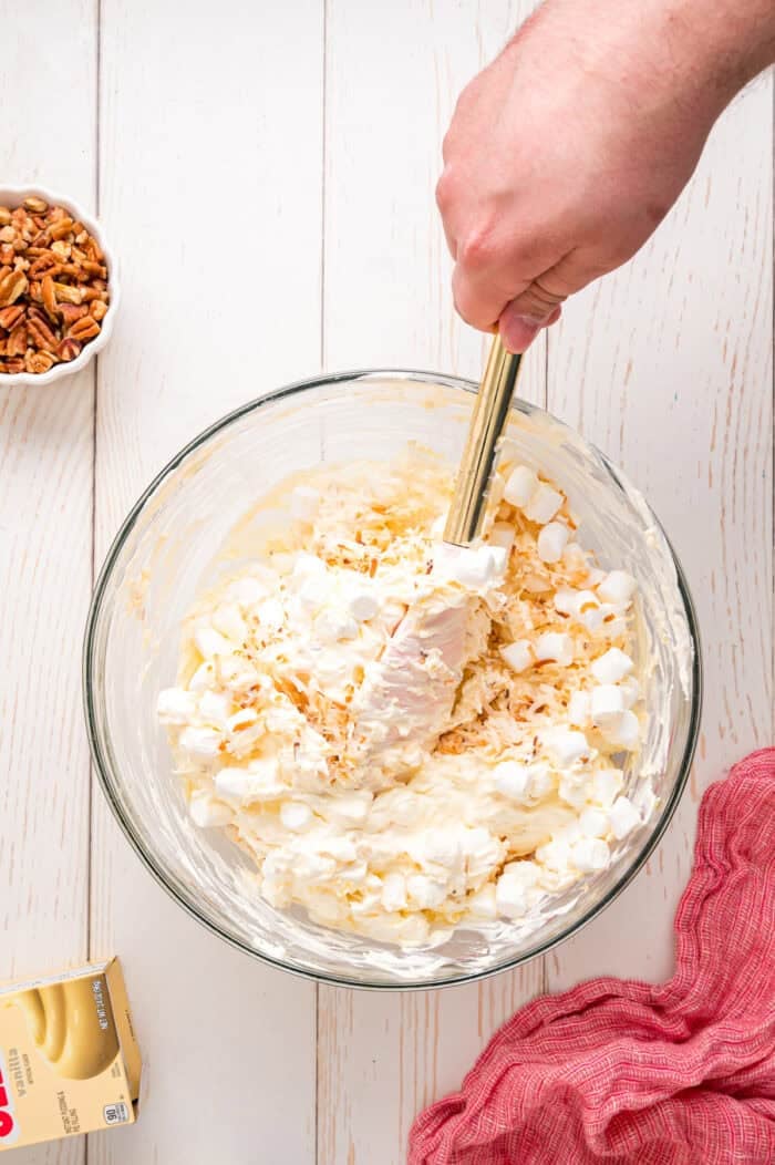 Pineapple Fluff is a quick and easy no-bake dessert that’s perfect for summer, with crushed pineapple, toasted coconut, and marshmallows. Folding coconut and mini marshmallows into the pineapple fluff mixture