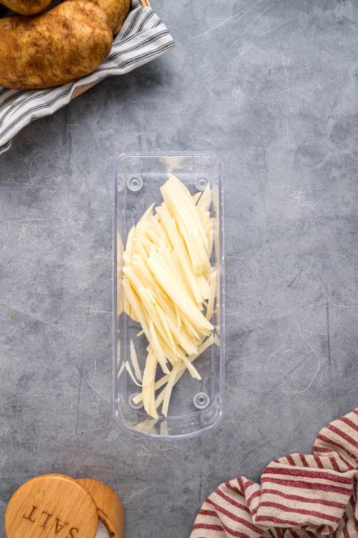 Made with just 3 ingredients, these Shoestring Fries are long, thin, and fry in just a few minutes. Serve with your favorite dipping sauces. Fries cut in a mandolin slicers