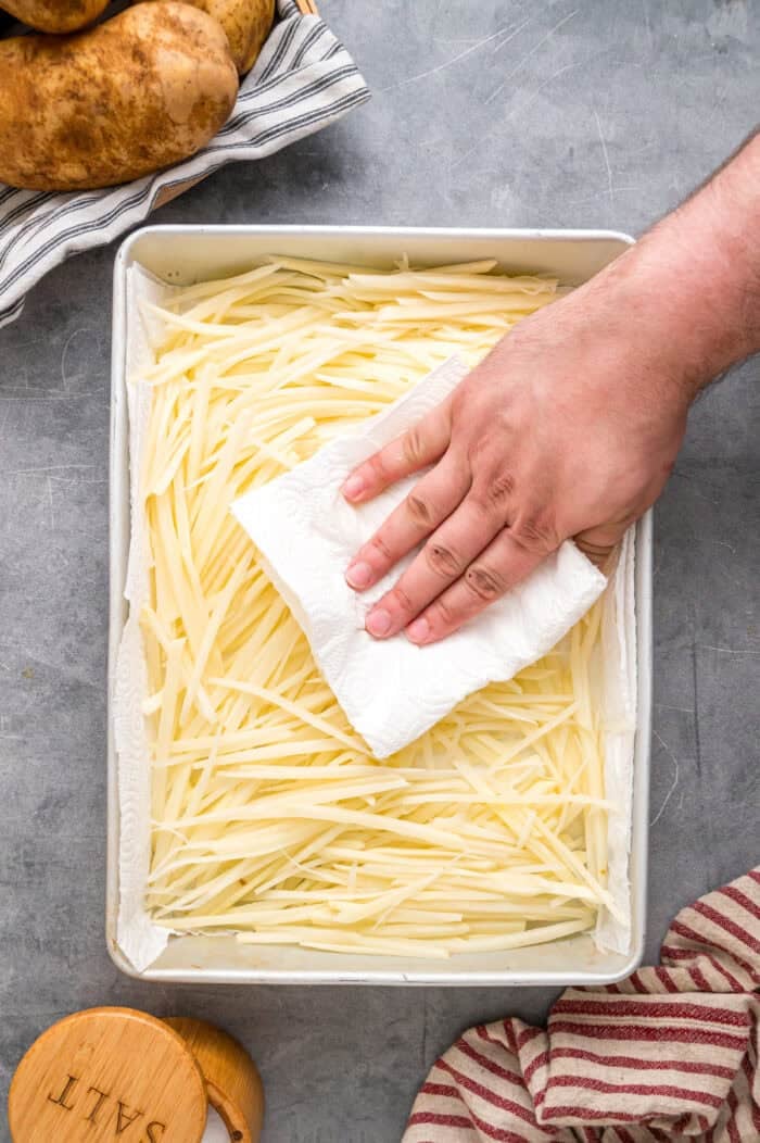 Made with just 3 ingredients, these Shoestring Fries are long, thin, and fry in just a few minutes. Serve with your favorite dipping sauces. Patting fries dry with a paper towel