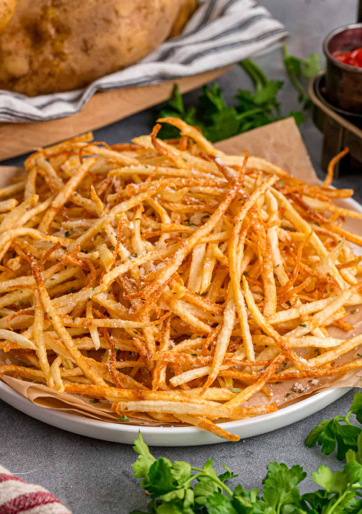 Made with just 3 ingredients, these Shoestring Fries are long, thin, and fry in just a few minutes. Serve with your favorite dipping sauces. Shoestring Fries on a plate