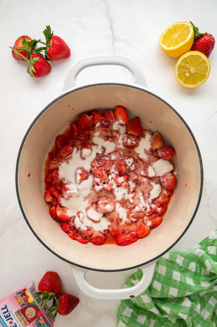 Made with just 4 ingredients, this Strawberry Jam recipe is quick and easy to make with no canning equipment required. Pectin sprinkled on sliced strawberries