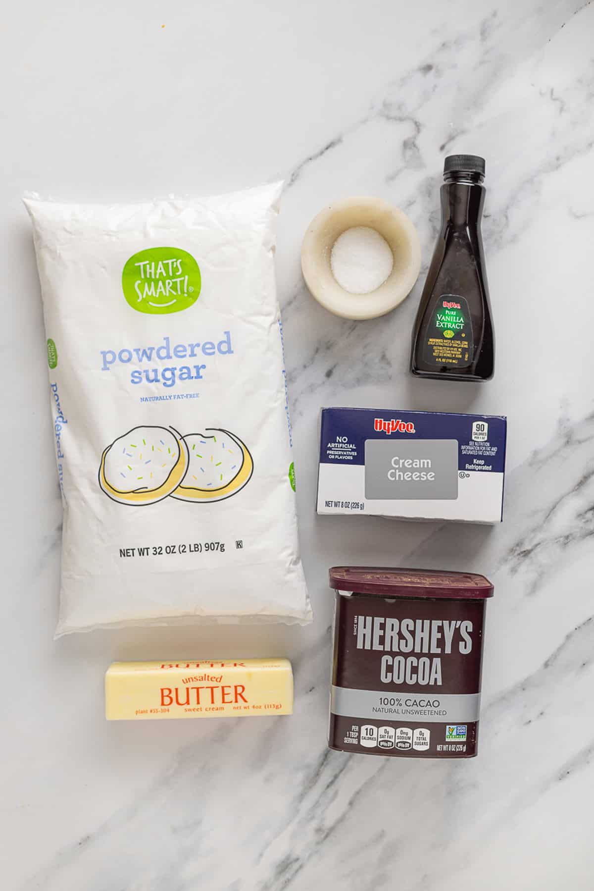 Overhead view of ingredients needed to make chocolate cream cheese frosting