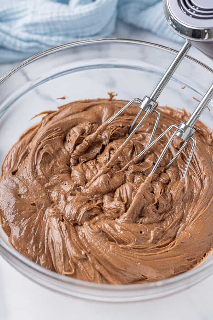 Chocolate cream cheese frosting in a mixing bowl