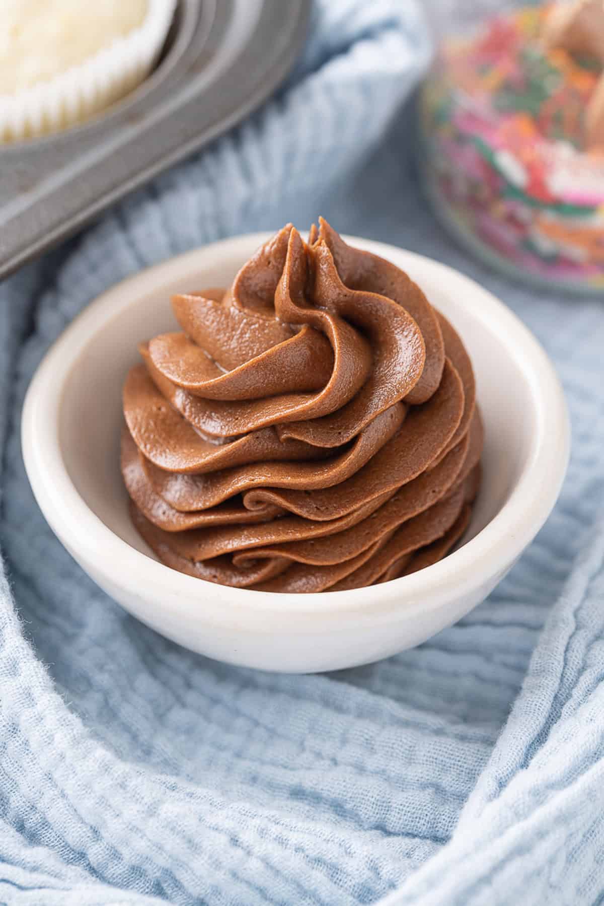 A bowl of chocolate cream cheese frosting