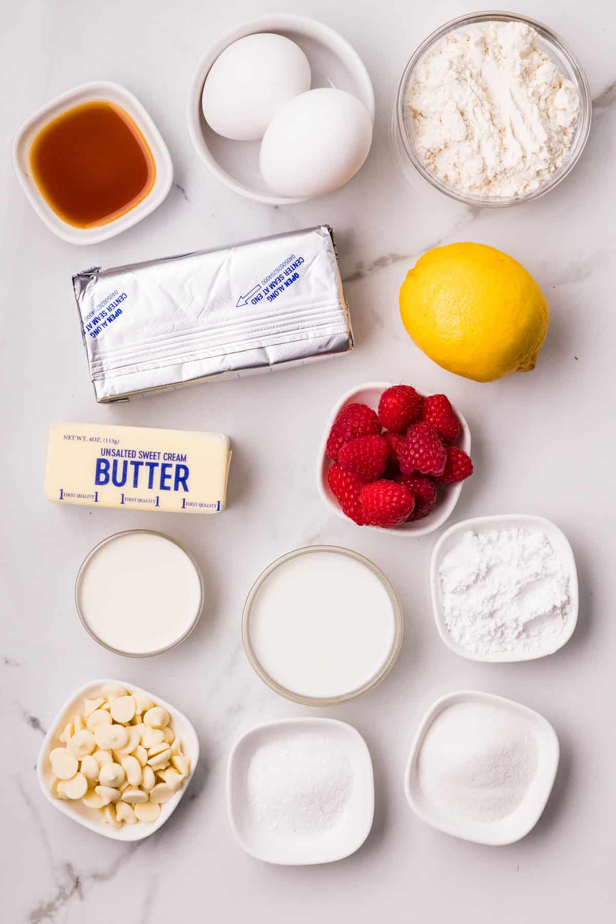 Overhead view of ingredients needed to make mille crepe cake with raspberry filling