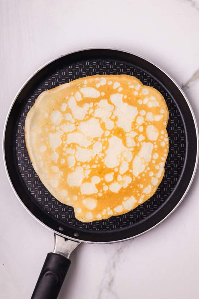 A crepe in a frying pan