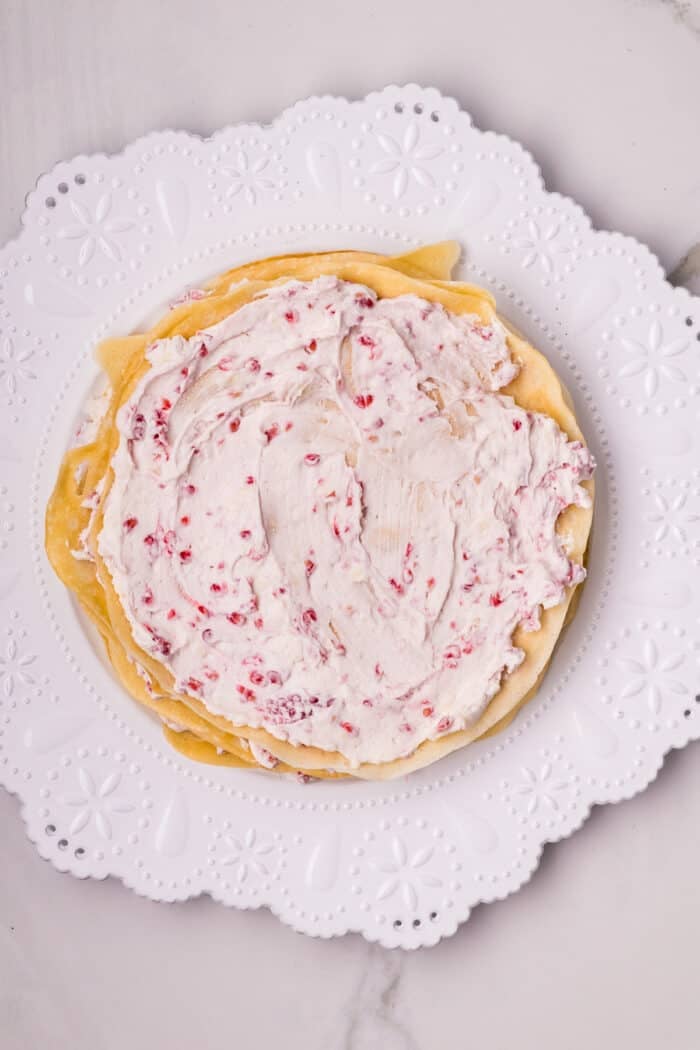 Raspberry cream filling spread on a crepe