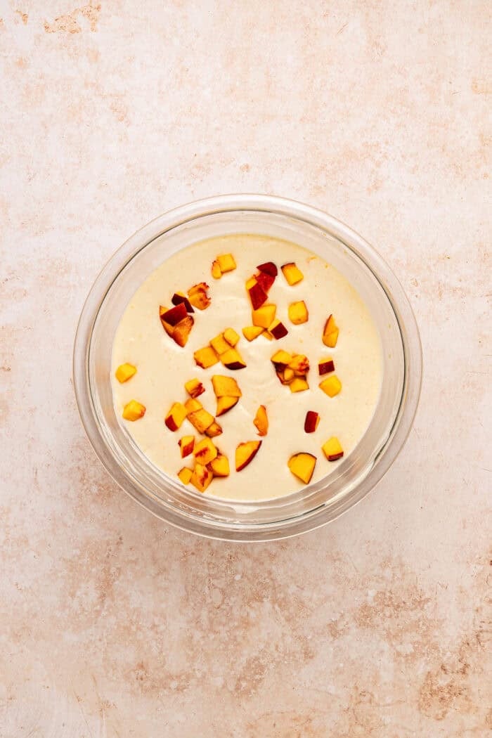 Fresh peaches are turned into a compote and swirled into a mixture of sweetened condensed milk & heavy cream in this No-Churn Peach Ice Cream. Diced peaches folded into the ice cream mixture