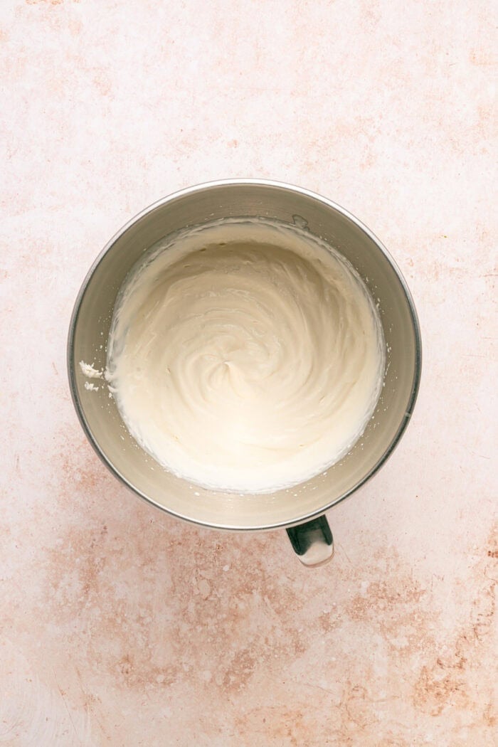 Fresh peaches are turned into a compote and swirled into a mixture of sweetened condensed milk & heavy cream in this No-Churn Peach Ice Cream. Whipped cream in a bowl