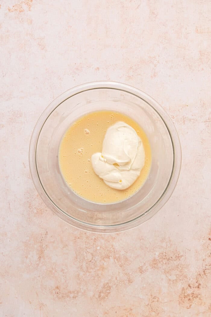 Fresh peaches are turned into a compote and swirled into a mixture of sweetened condensed milk & heavy cream in this No-Churn Peach Ice Cream. Folding whipped cream into sweetened condensed milk