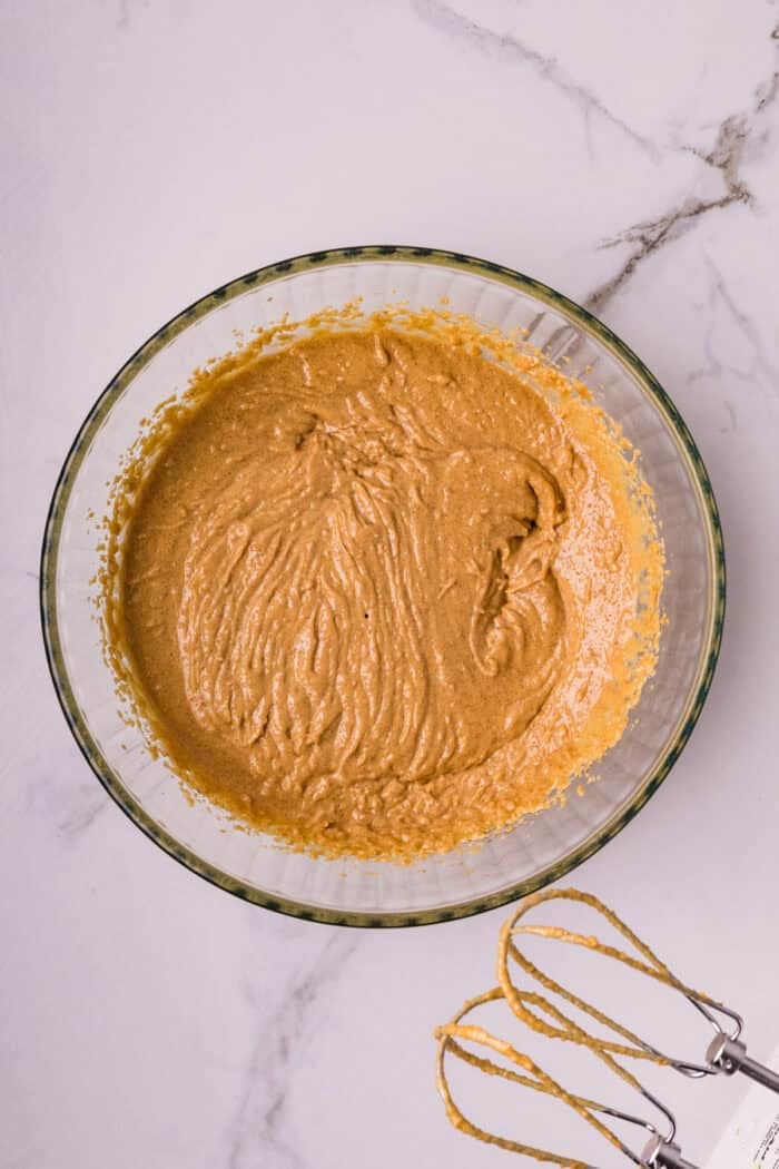 These soft and chewy Peanut Butter Marshmallow Cookies are loaded with rich peanut butter flavor and a marshmallow surprise. Wet cookie ingredients in a bowl
