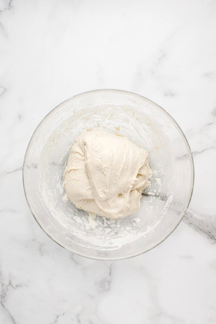 Made with an active sourdough starter, pantry staples, and a simple process, this Sourdough Bread recipe is perfect for beginners. Sourdough bread dough stretched over itself