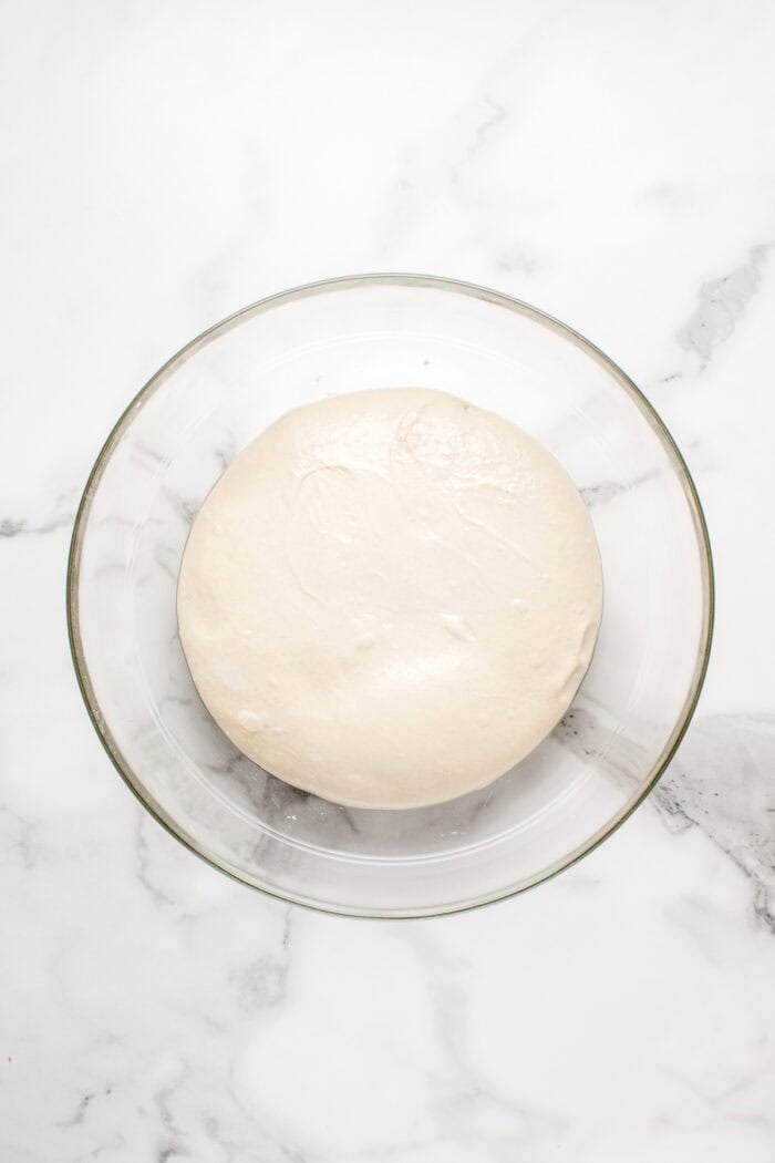 Made with an active sourdough starter, pantry staples, and a simple process, this Sourdough Bread recipe is perfect for beginners. Sourdough bread dough after it's had time to rise