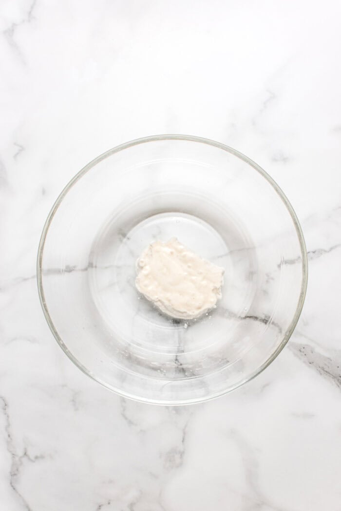 Made with an active sourdough starter, pantry staples, and a simple process, this Sourdough Bread recipe is perfect for beginners. Sourdough starter in a glass bowl