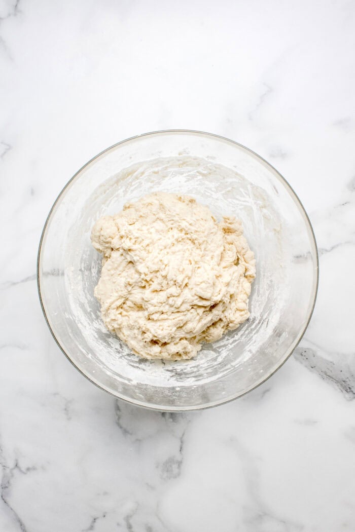 Made with an active sourdough starter, pantry staples, and a simple process, this Sourdough Bread recipe is perfect for beginners. Sourdough dough in a bowl