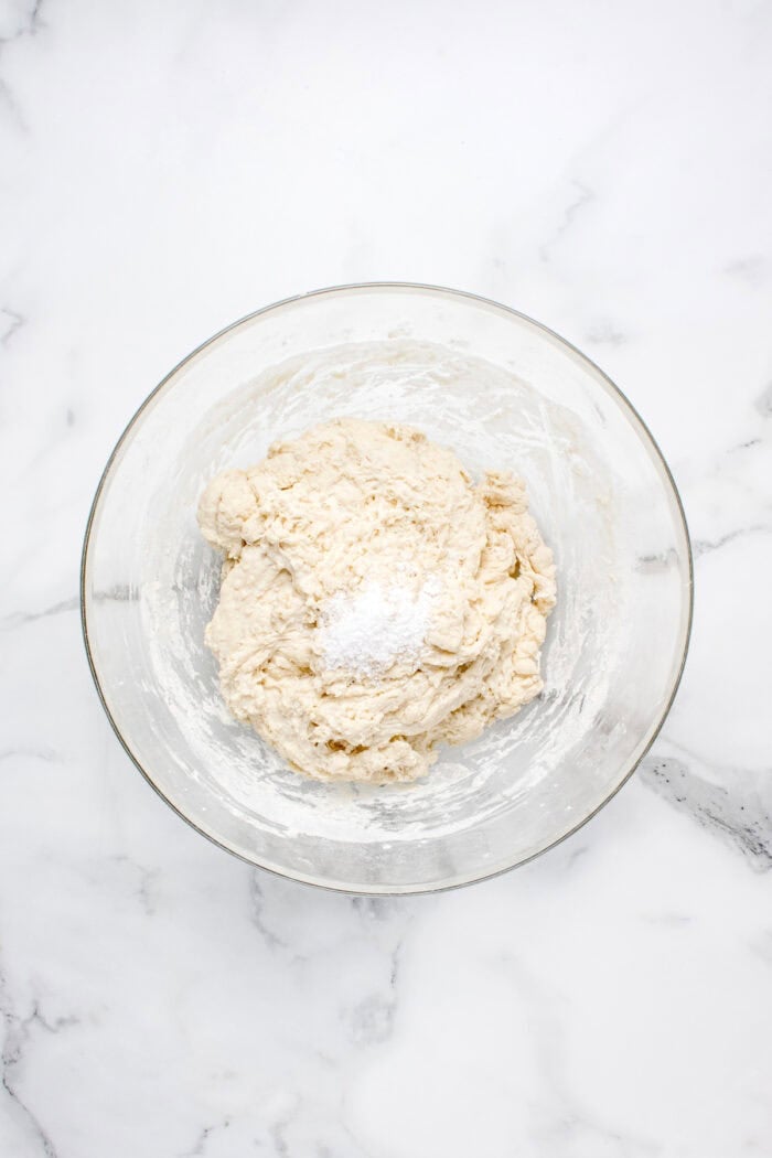 Made with an active sourdough starter, pantry staples, and a simple process, this Sourdough Bread recipe is perfect for beginners. Salt added to the bowl of sourdough dough