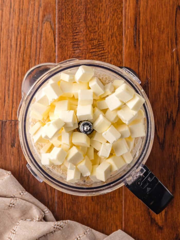 Cubes of butter in a food processor with flour