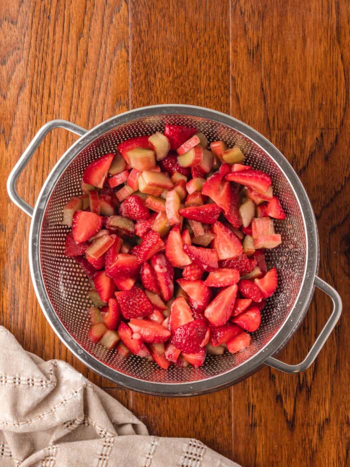 Strawberry and rhubarb in a strainer