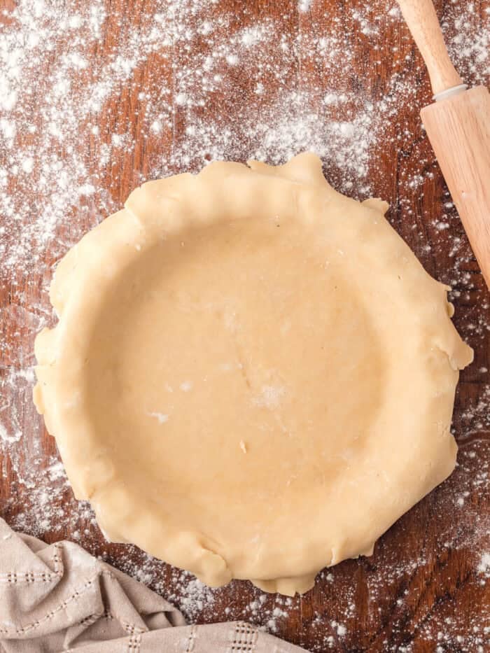Pie crust folded over a pie plate