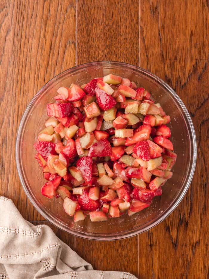 Sliced strawberries and rhubarb in a bowl