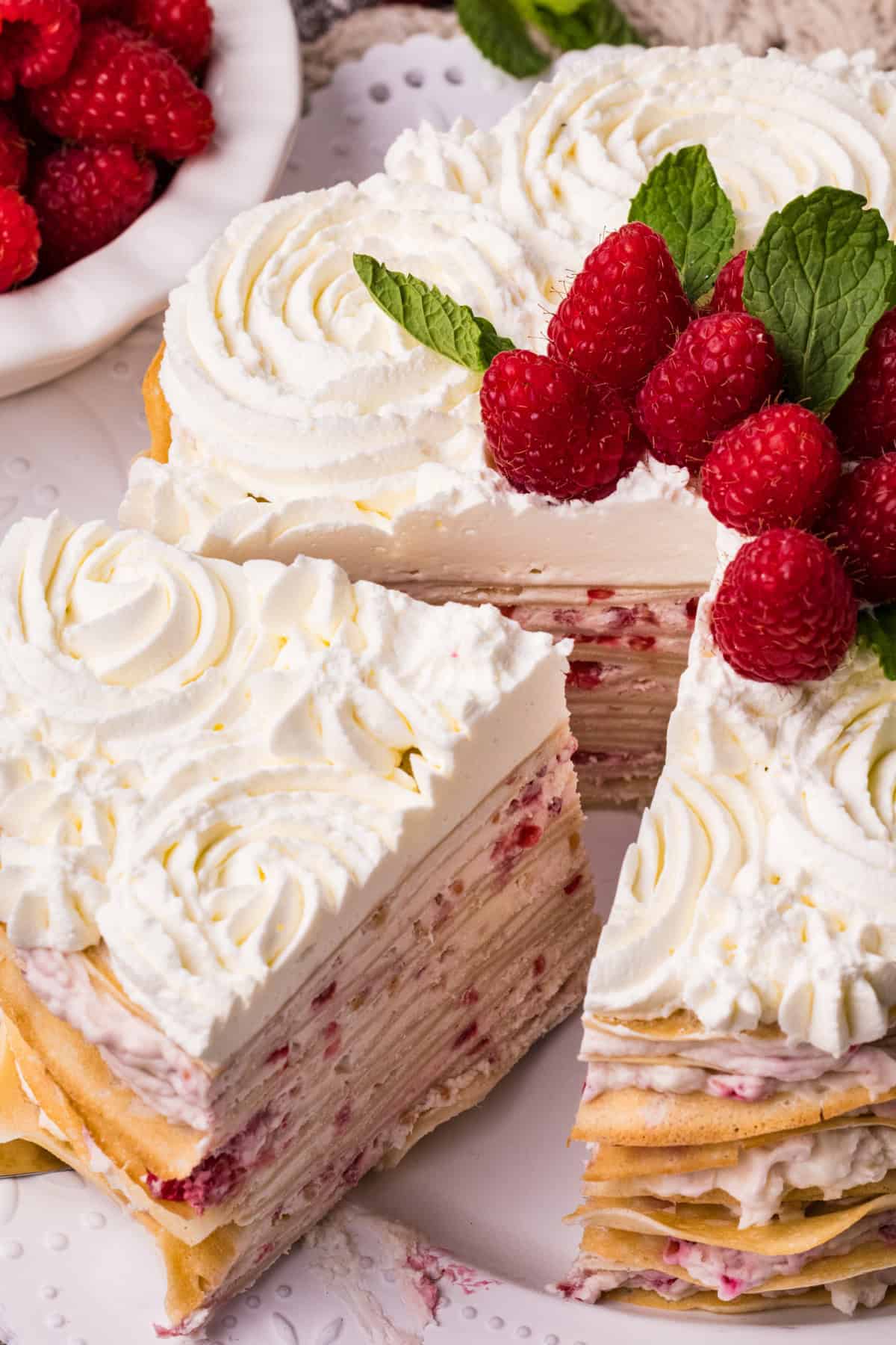 a slice of crepe cake being lifted on a spatula