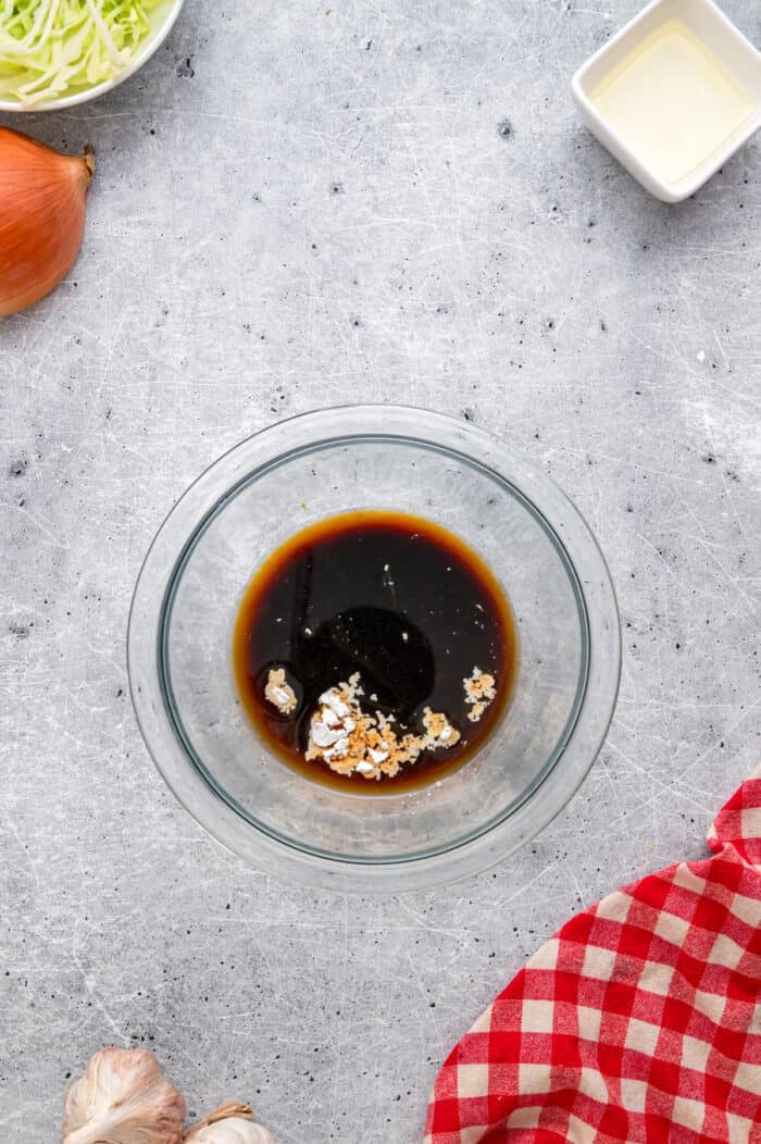With tender noodles coated in a savory sauce and crunchy veggies, this copycat Panda Express Chow Mein tastes even better than takeout. Chow mein sauce ingredients in a small bowl