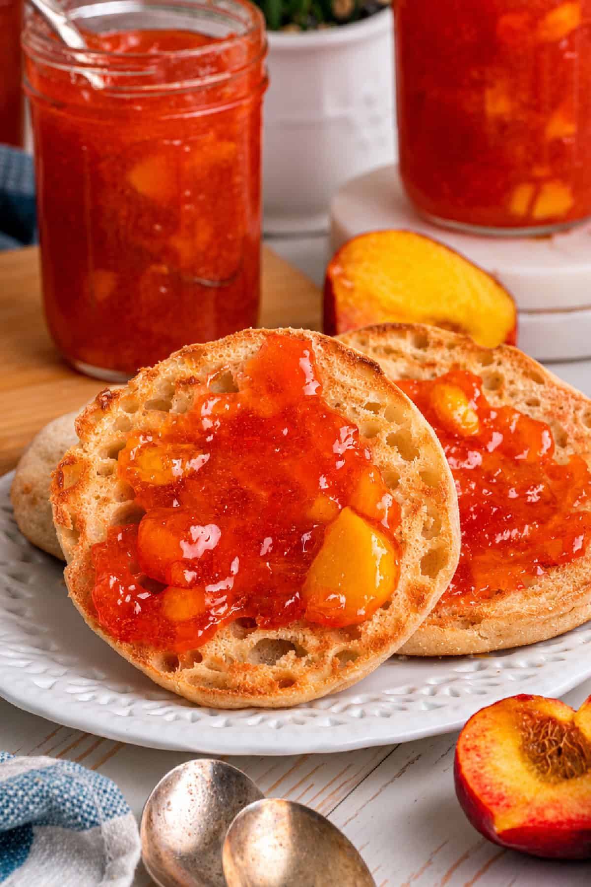 peach jam spread on an English muffin