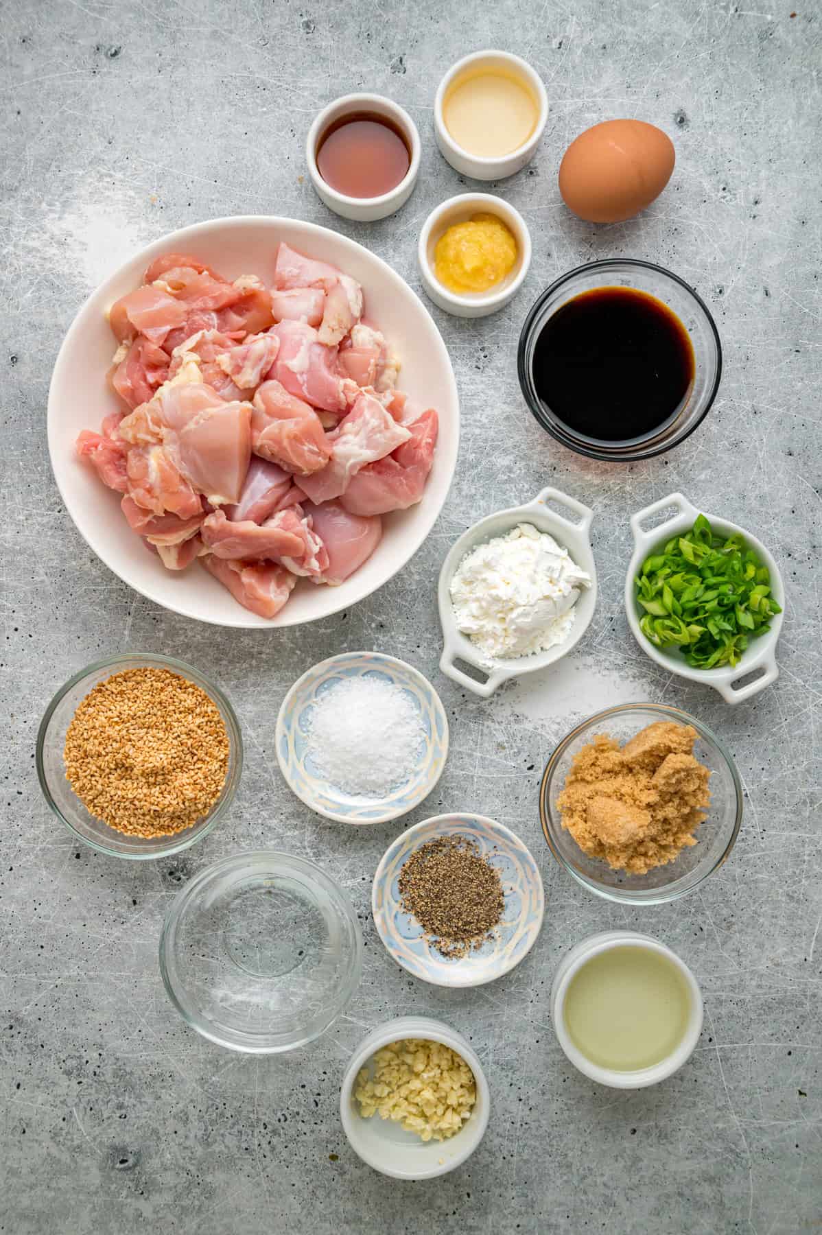 Ready in just 30 minutes, this Sesame Chicken recipe features tender, juicy pieces of chicken coated in a savory-sweet and nutty sauce. Overhead view of ingredients needed to make sesame chicken