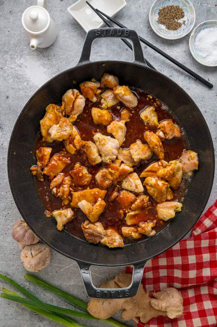 Ready in just 30 minutes, this Sesame Chicken recipe features tender, juicy pieces of chicken coated in a savory-sweet and nutty sauce. Pieces of chicken cooking in sesame sauce