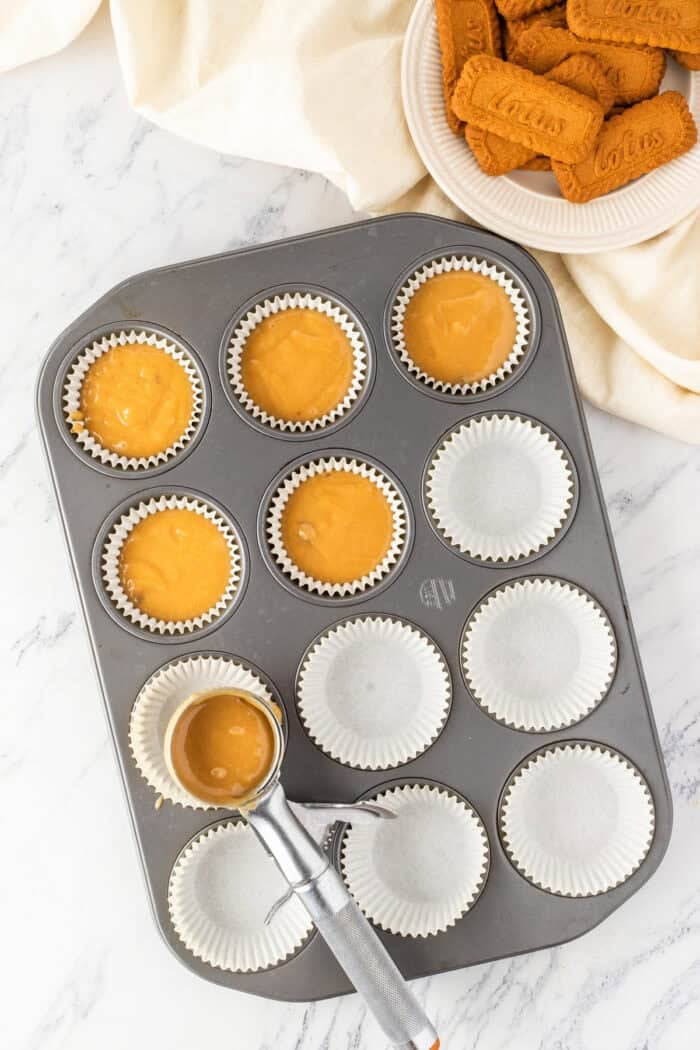 These Biscoff Cupcakes are soft, ultra-moist, and packed with warm caramelized flavor from cookie butter in both the batter and frosting. Filling cupcake liners with batter