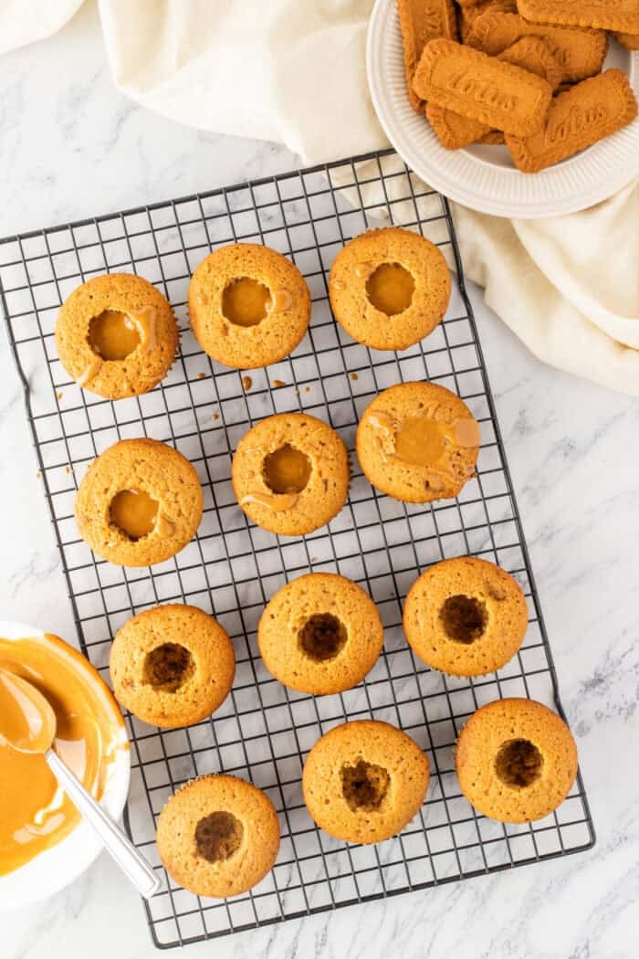 These Biscoff Cupcakes are soft, ultra-moist, and packed with warm caramelized flavor from cookie butter in both the batter and frosting. The center of cupcakes filled with cookie butter