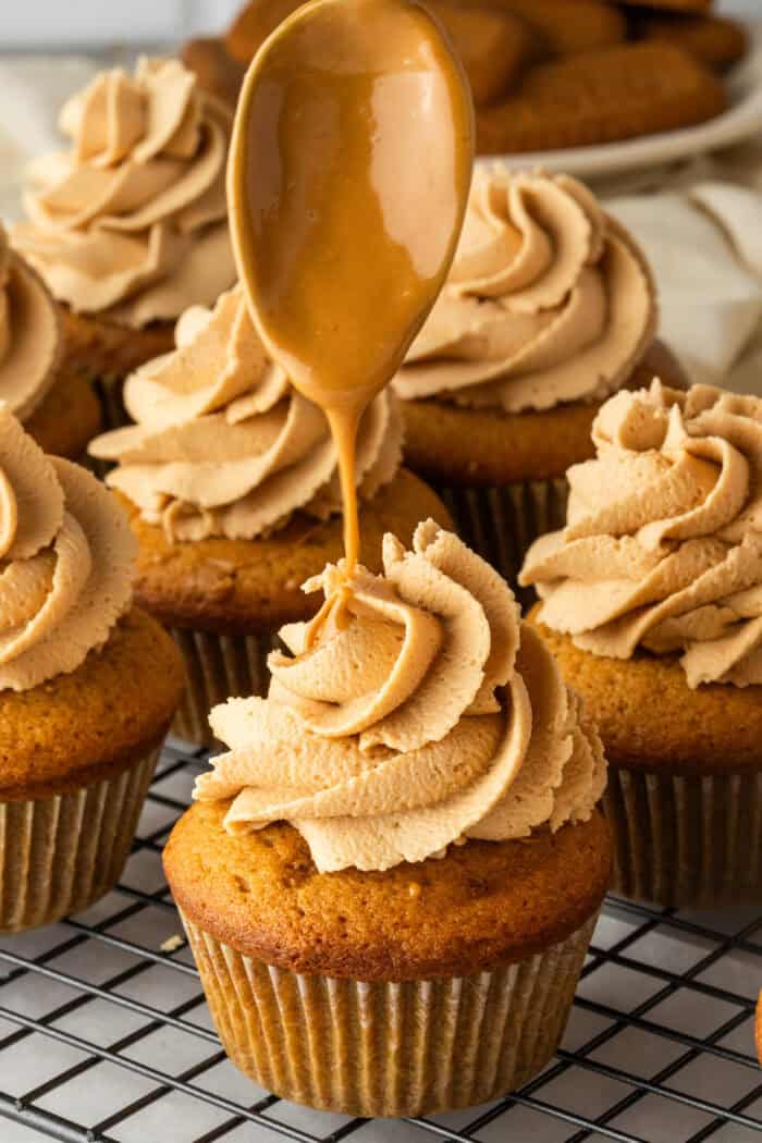These Biscoff Cupcakes are soft, ultra-moist, and packed with warm caramelized flavor from cookie butter in both the batter and frosting. Drizzling cookie butter on top of frosted Biscoff cupcakes