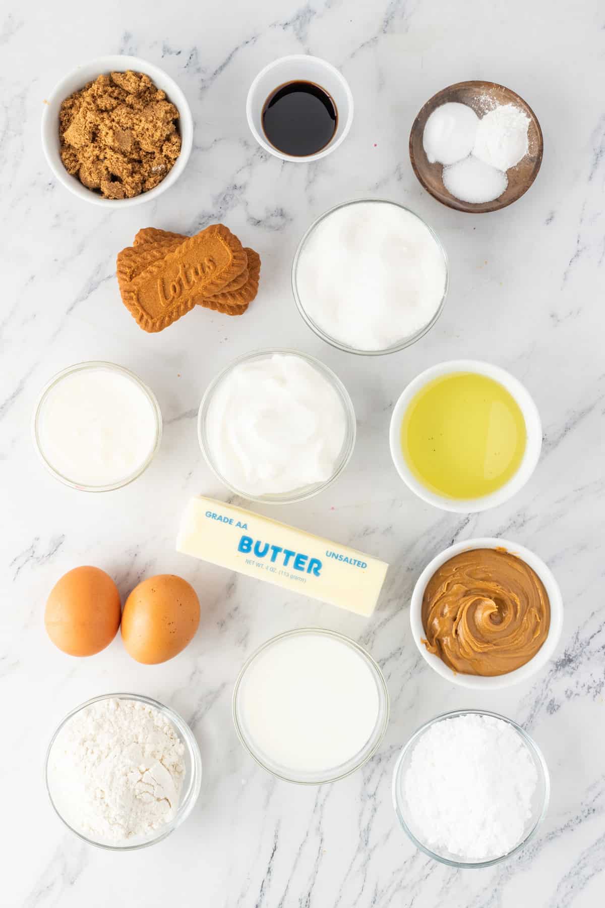 These Biscoff Cupcakes are soft, ultra-moist, and packed with warm caramelized flavor from cookie butter in both the batter and frosting. Overhead view of ingredients needed to make biscoff cupcakes