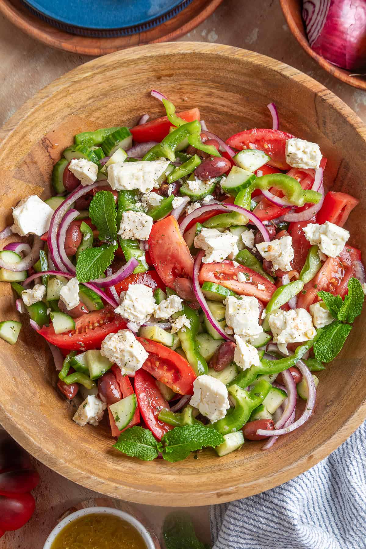 Overhead view of Greek salad in a wooden bowl