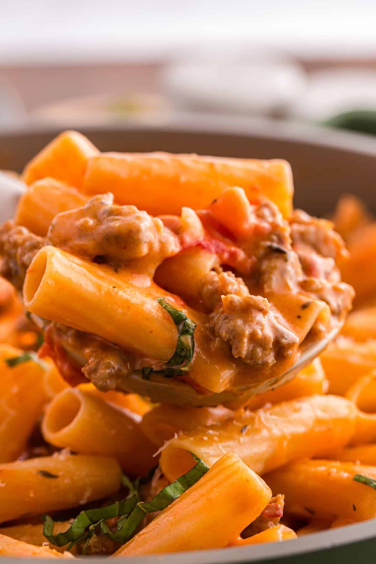 Italian Sausage Pasta is ready in just 30 minutes with a handful of ingredients. Creamy, decadent, and flavorful! Close up of a bowl of Italian sausage pasta