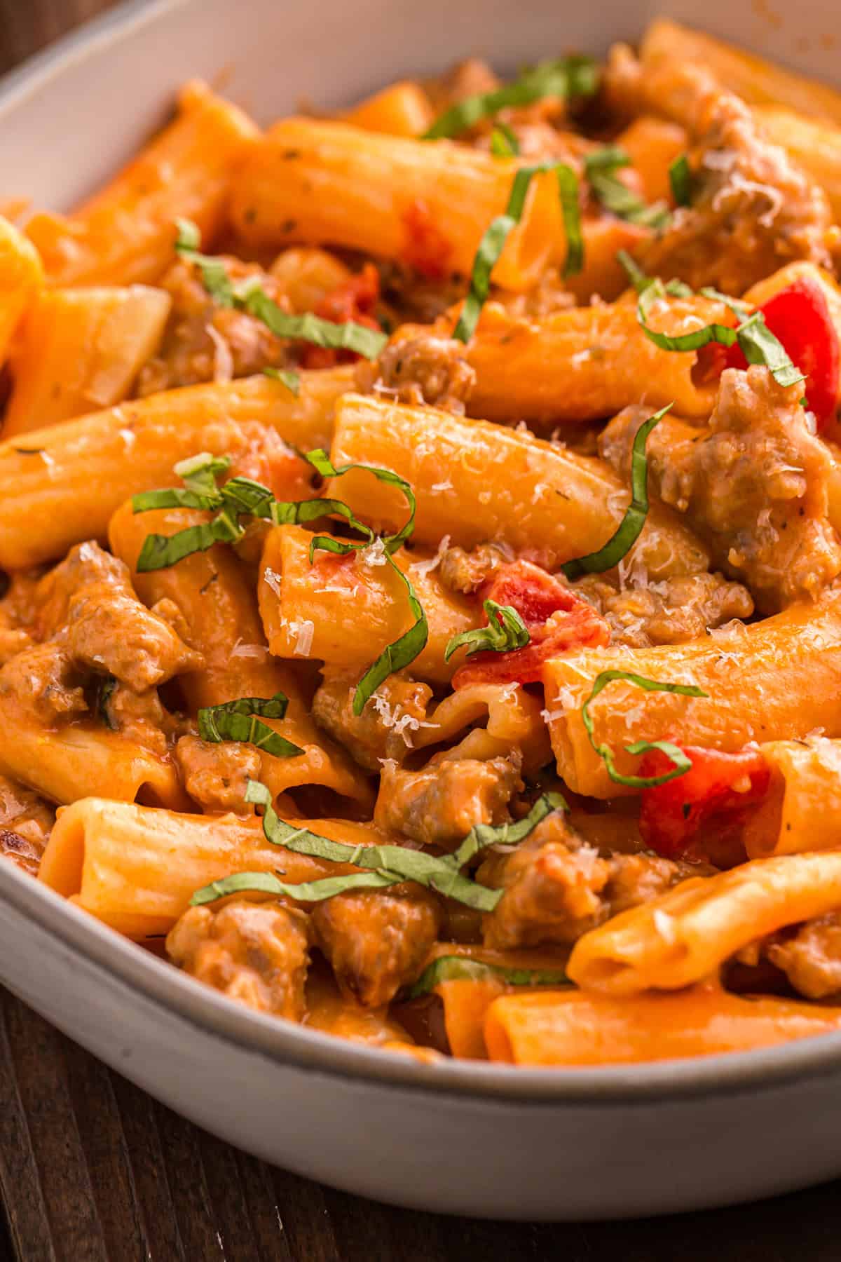 Italian Sausage Pasta is ready in just 30 minutes with a handful of ingredients. Creamy, decadent, and flavorful! Overhead view of a bowl of Italian sausage pasta