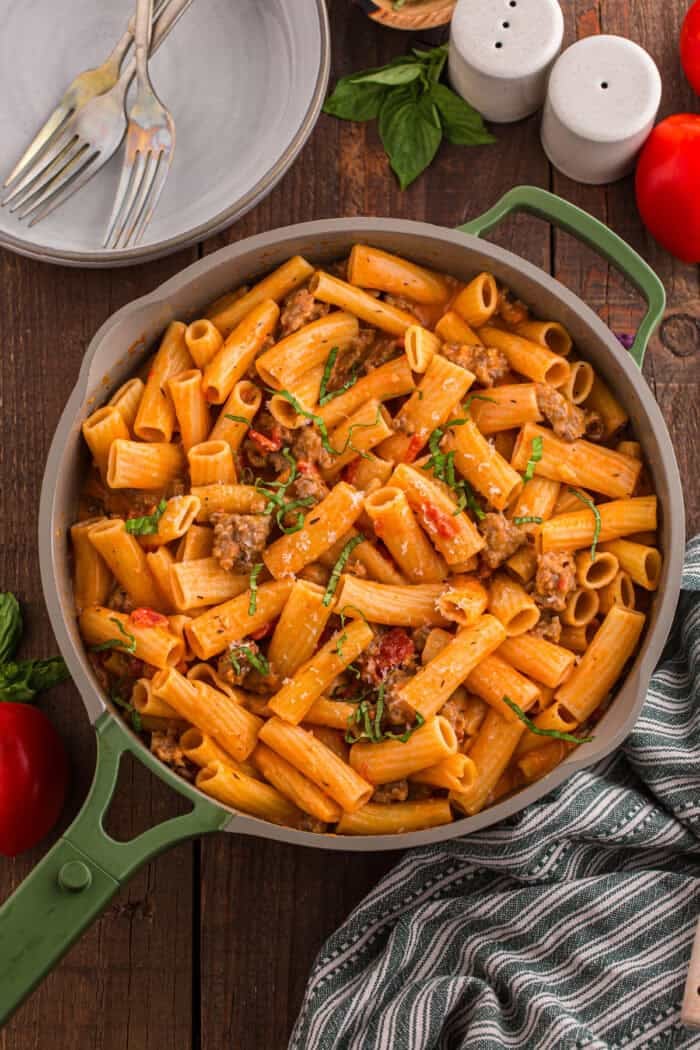 Italian Sausage Pasta is ready in just 30 minutes with a handful of ingredients. Creamy, decadent, and flavorful! Overhead view of a pan of creamy Italian sausage pasta