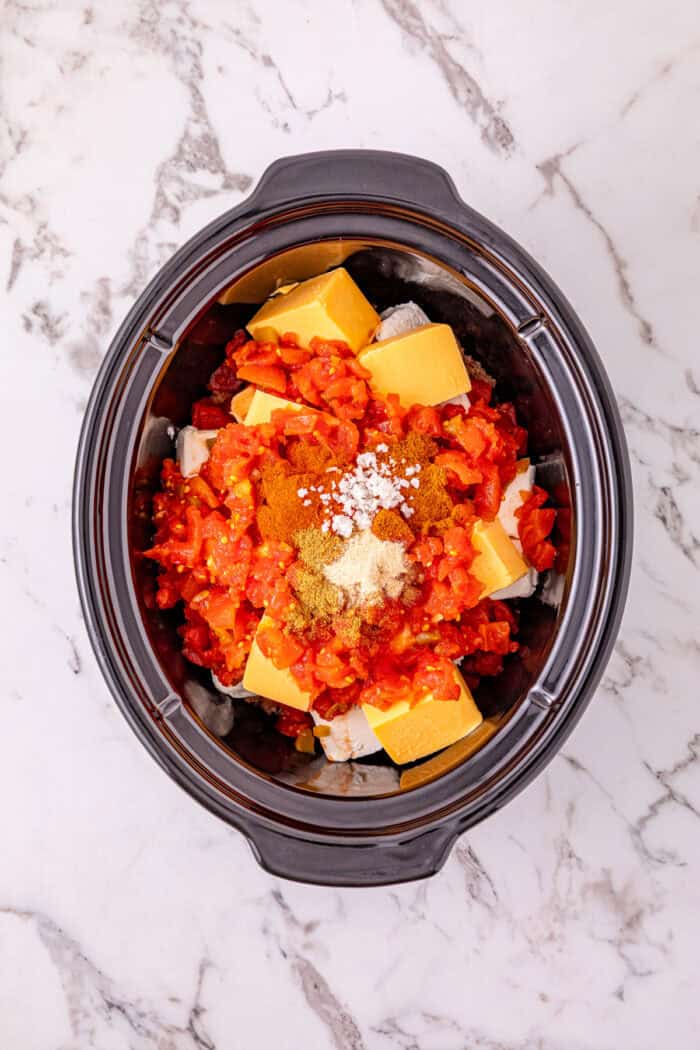 Cheesy Sausage Dip turns ground sausage, Velveeta, cream cheese, and Rotel into a creamy, cheesy, and irresistible party dip in just minutes. Sausage dip ingredients in the slow cooker