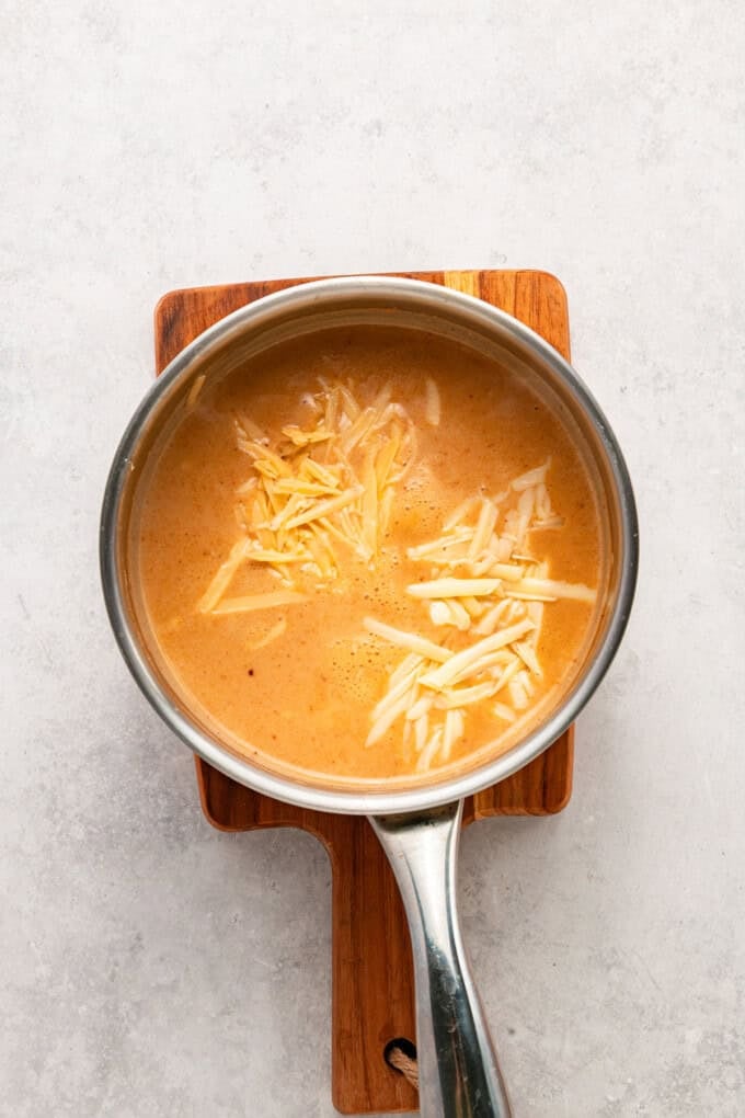 This Beer Cheese Dip is warm, sharp, and just a little smoky, with a combination of cheddar & gruyere and your favorite beer. Stirring shredded cheese into beer dip